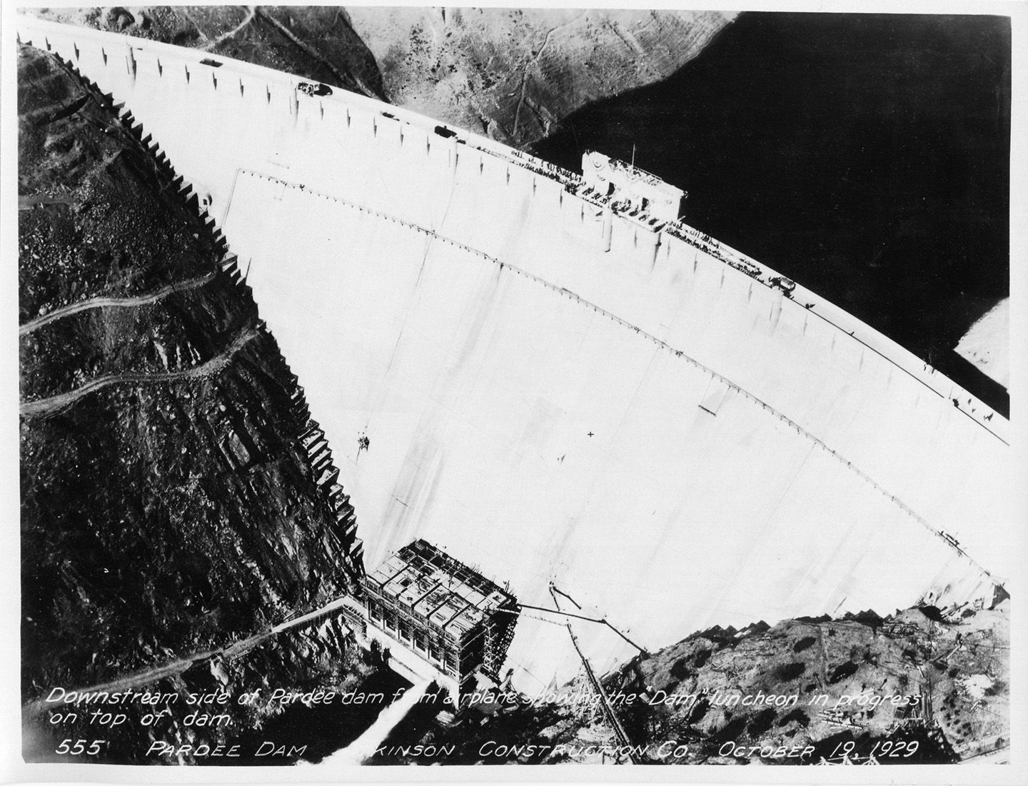 Downstream side of Pardee Dam from airplane showing "Dam" luncheon in progress. (October 1929)	