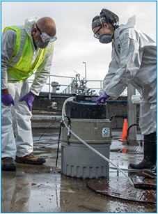 Wastewater Inspectors Kiley (left) and Cheryl (right) extract samples.