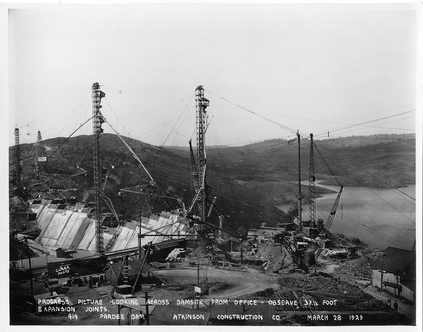 Progress picture looking across dam site from office - observe 37 1/2 foot expansion joints. (March 1929)