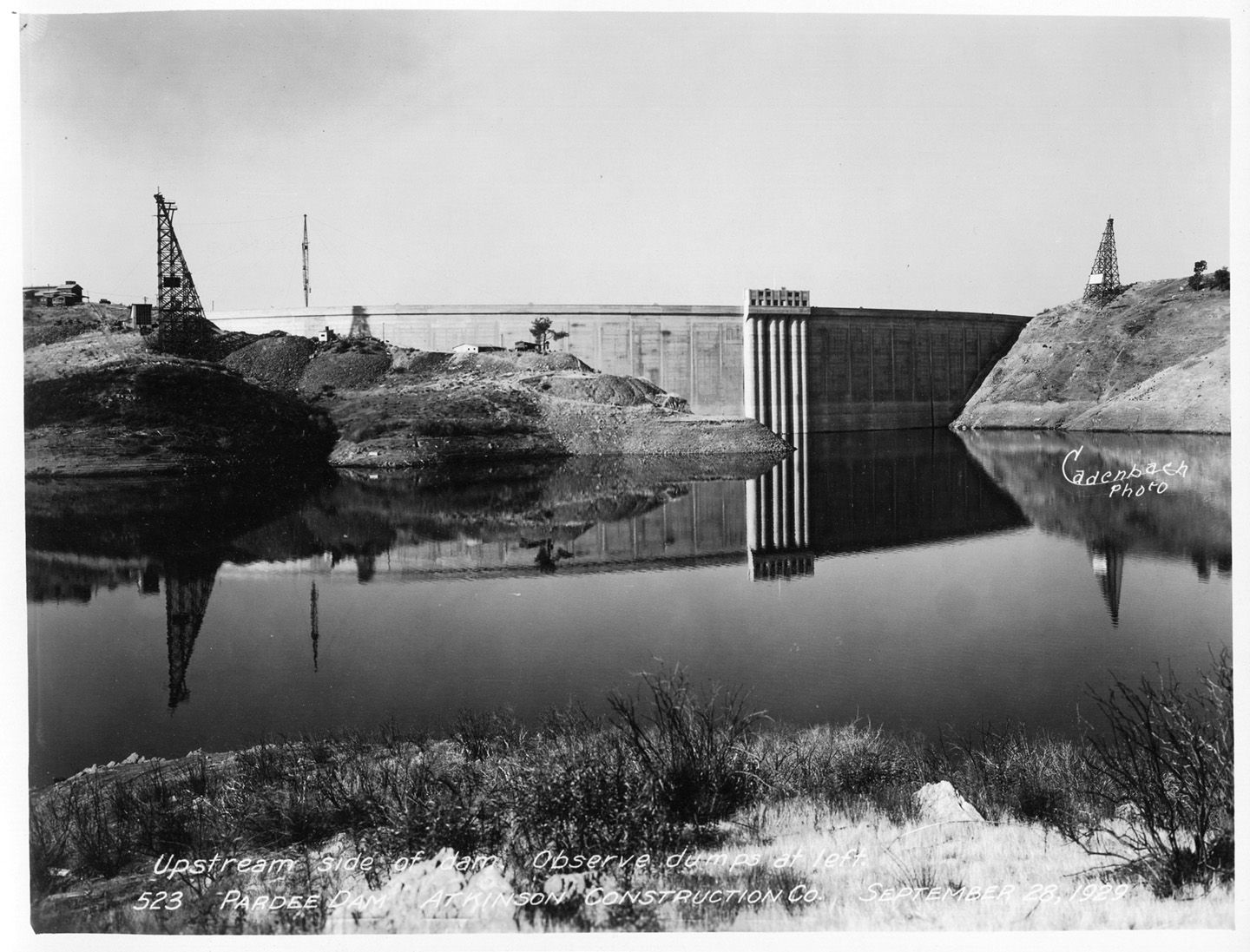 Upstream side of dam. Observe dumps at left. (September 1929)	