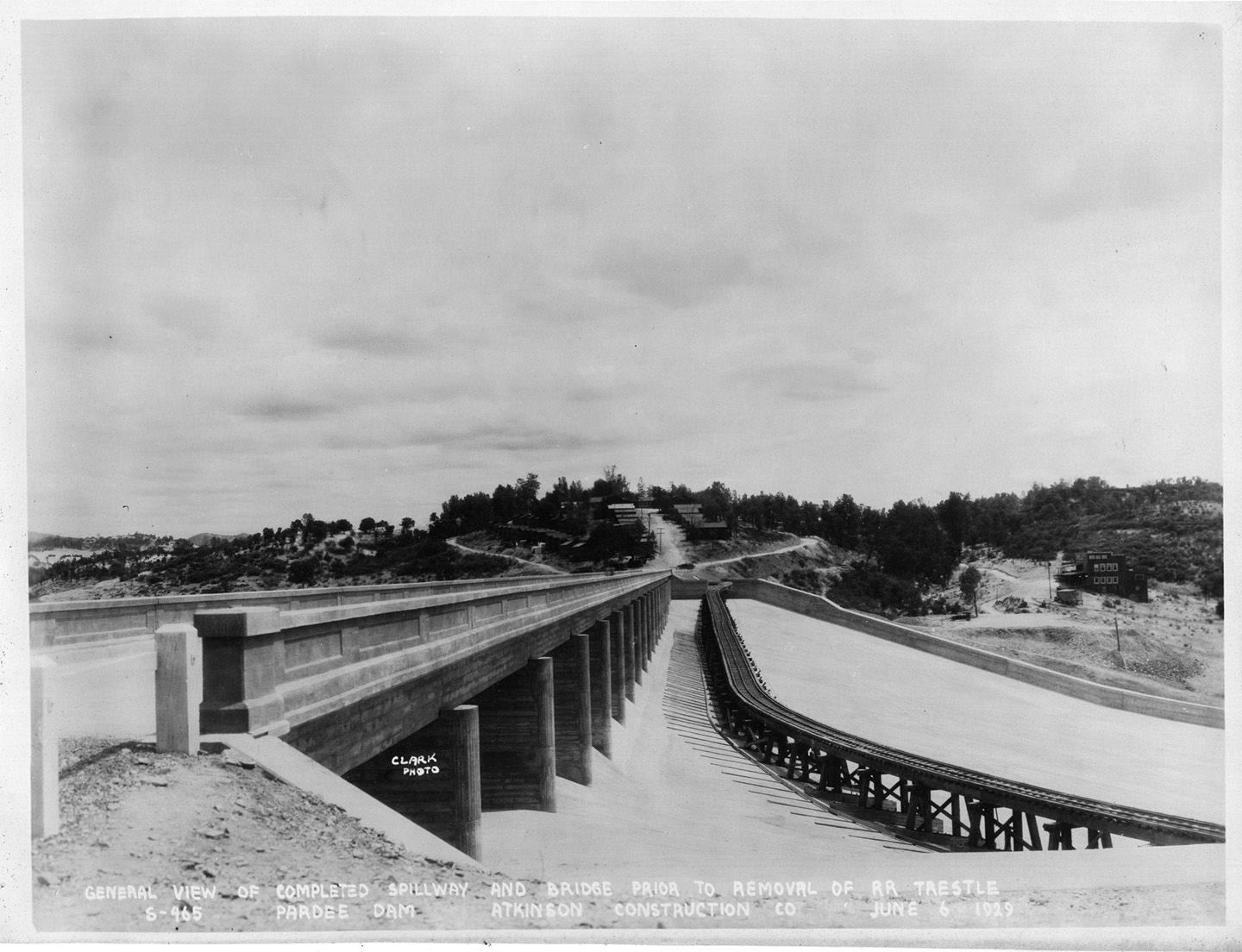 General view of completed spillway and bridge prior to removal of RR trestle. (June 1929)	