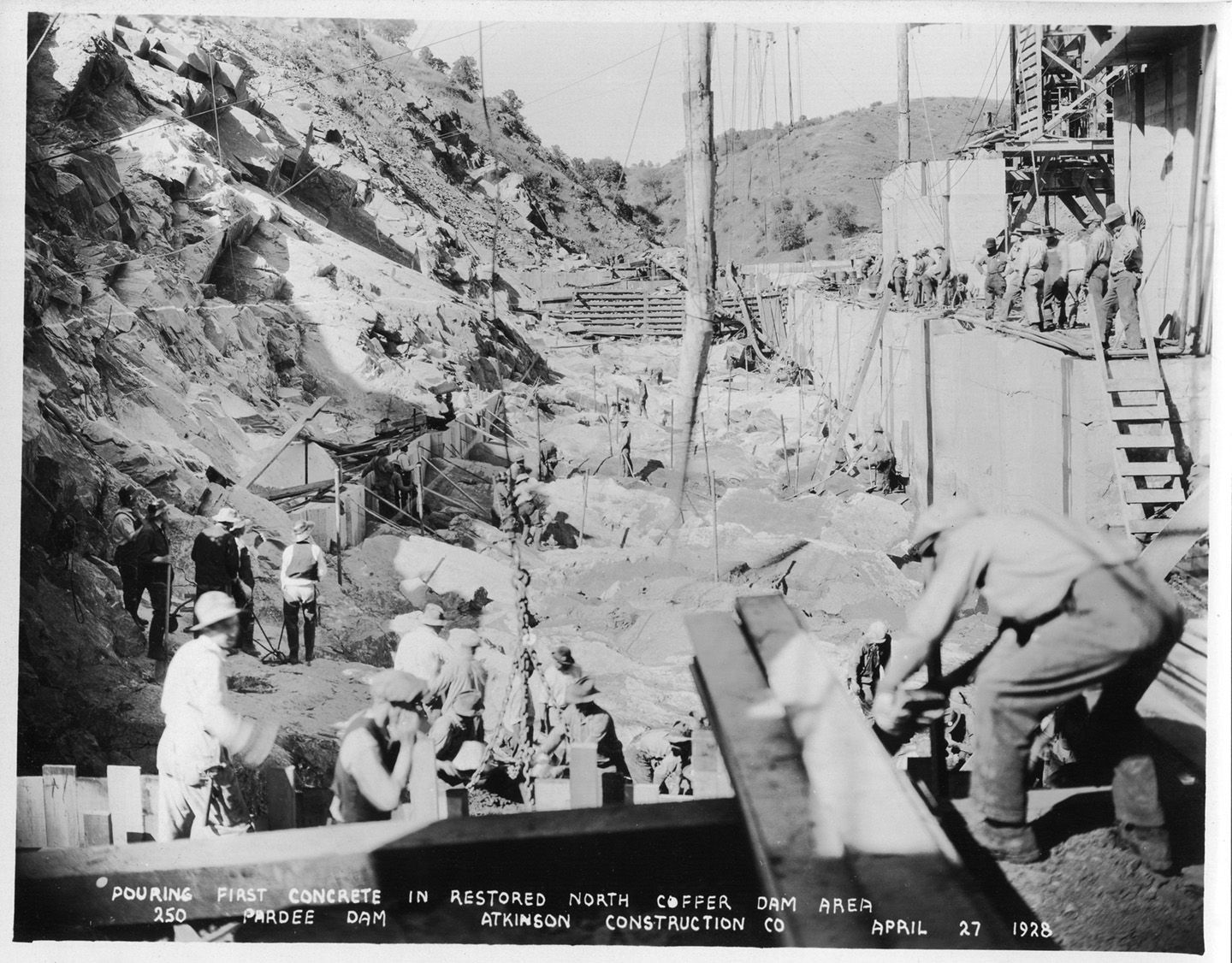 Pouring first concrete in restored north coffer dam area. (April 1928)