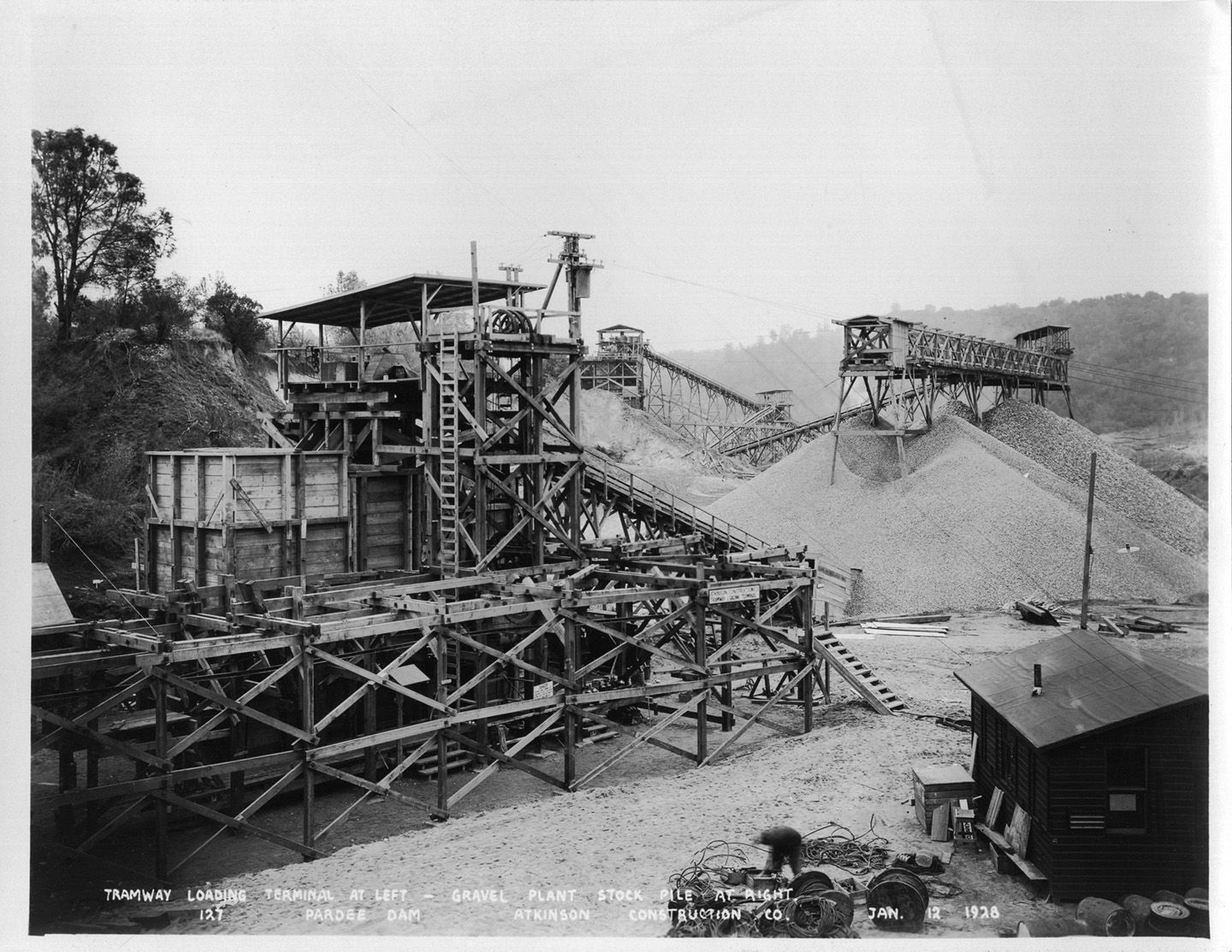 Tramway loading terminal at left - gravel plant stockpile at right. (January 1928)