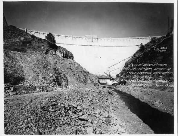 View of downstream side of dam showing river channel excavation in progress. (September 1929)