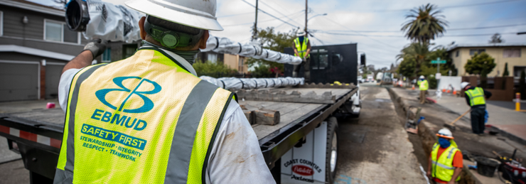 "Investing in the future" "Image of EBMUD crew putting pipes in the ground"